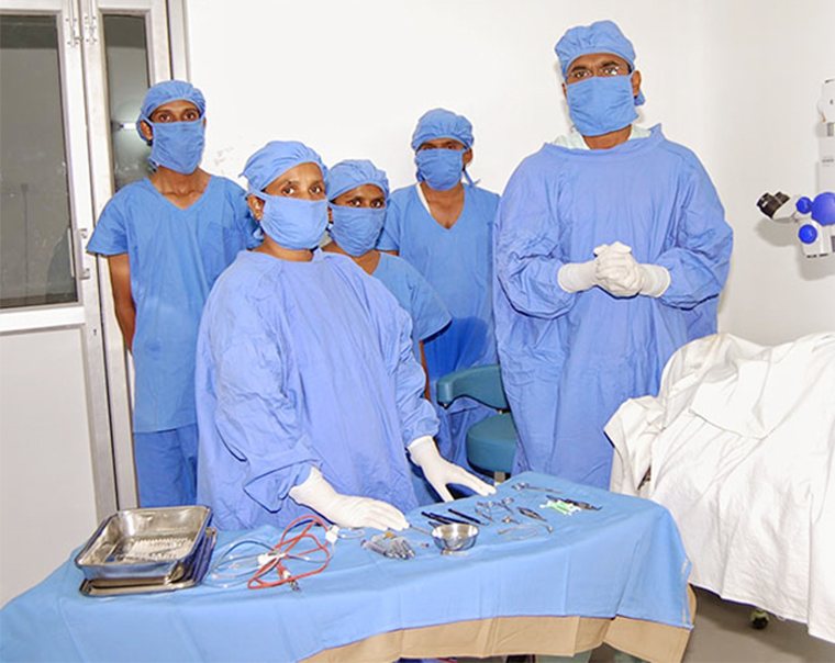 The surgical team scrubbed and ready in the operation theatre.