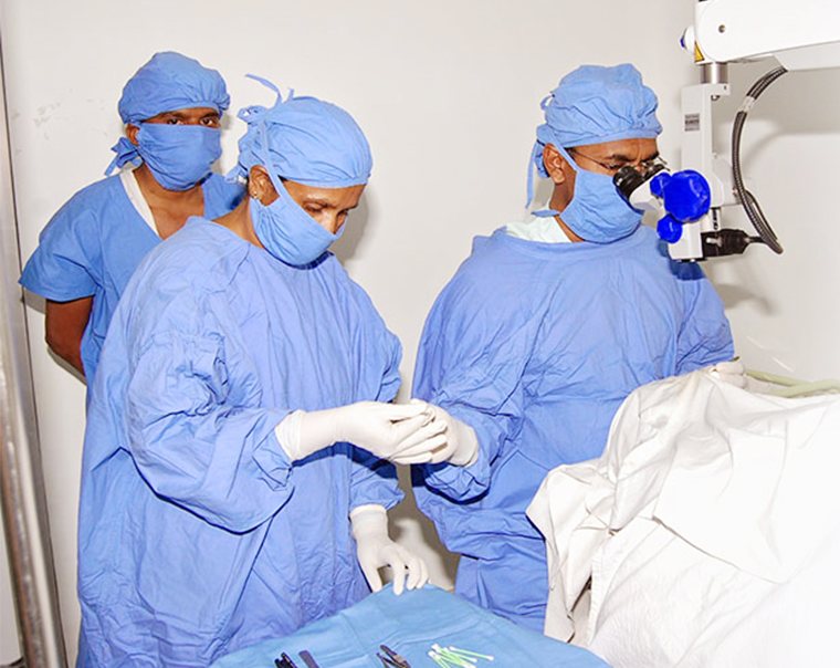 Cataract surgery under the operating microscope.